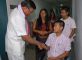 Shri K. Padmanabhiah, Fomer Home Secretary and Government of India's Representative in the Naga Peace Talks, with Philem Johnson Singh (27), Gun Survivor from Manipur. Johnson was donated a wheel chair during the Day of Action by CAFI.